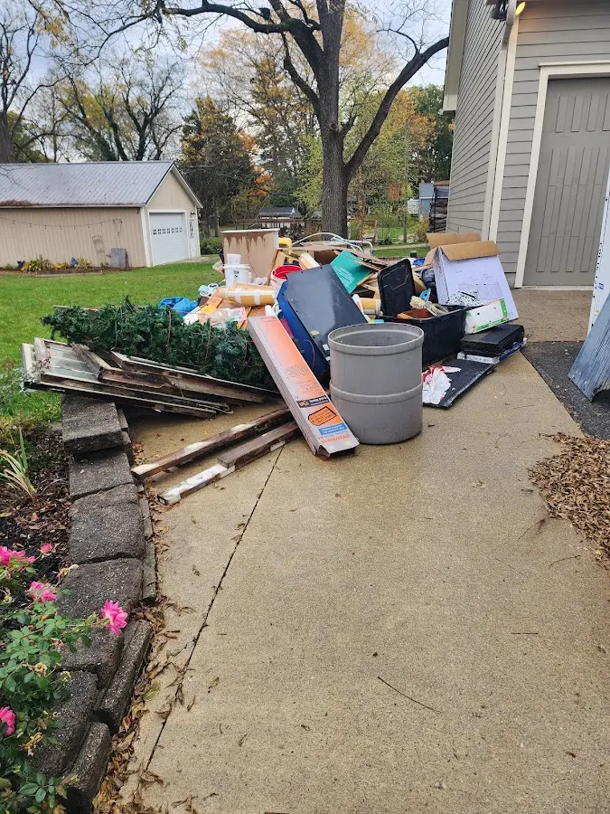 Dumpster being loaded with debris for Commercial Dumpster Rental in Port Royal